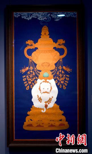 圖為5月16日，展覽中的新創(chuàng)唐卡作品《瑞象承香》?！±盍?攝